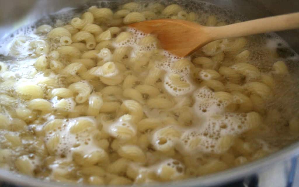 pasta cooking in a pot of boiling water