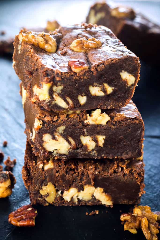Three Nutty Homemade Brownies stacked on top of each other