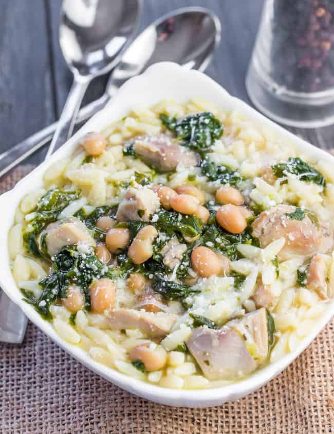 Italian Chicken and Spinach Pasta in a bowl with grated cheese