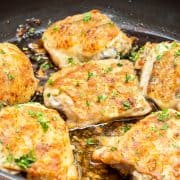 Baked Garlic Chicken Thighs with crispy skin in a pan