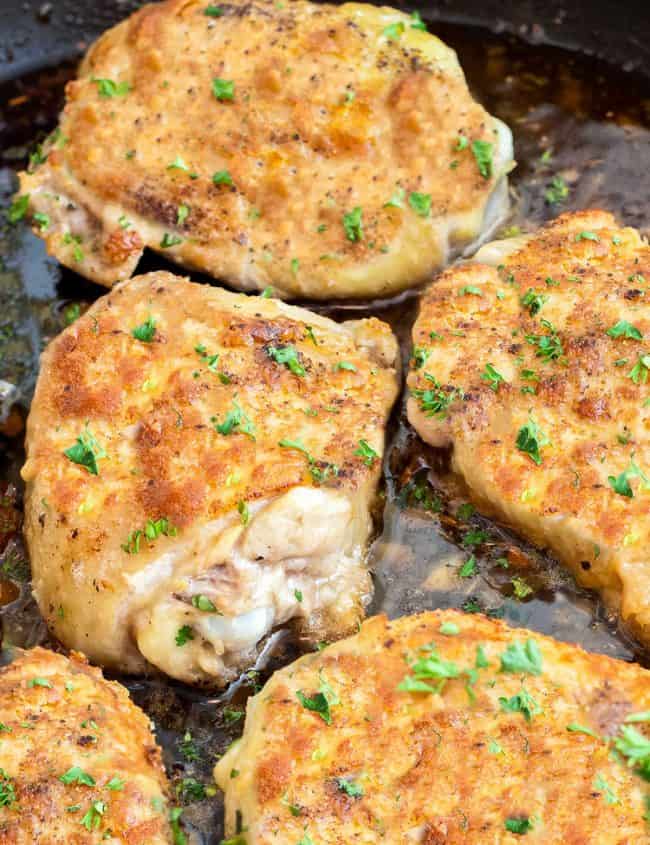 Baked Garlic Chicken Thighs with crispy skin in a pan