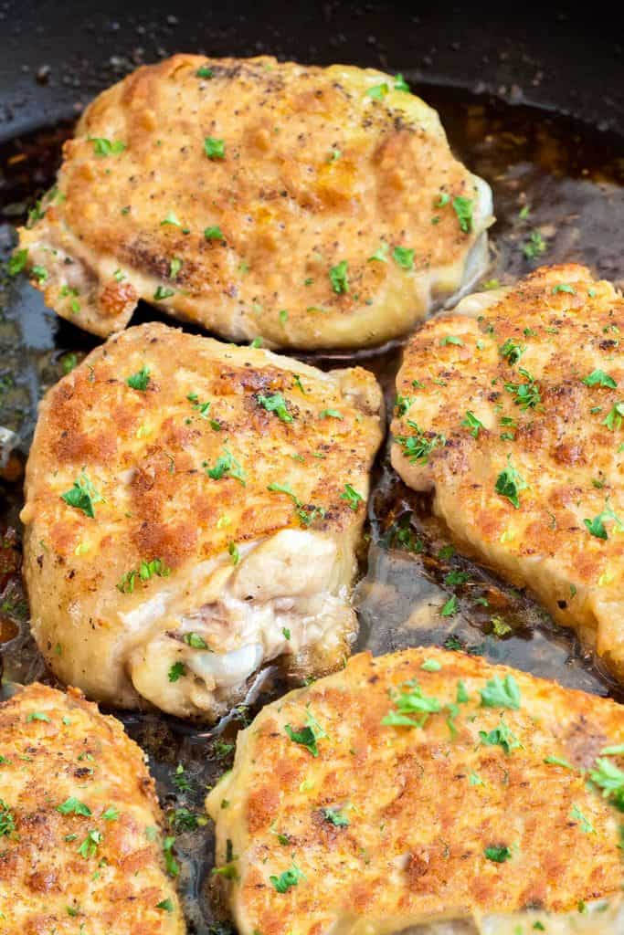 Baked Chicken Thighs with crispy skin in a pan
