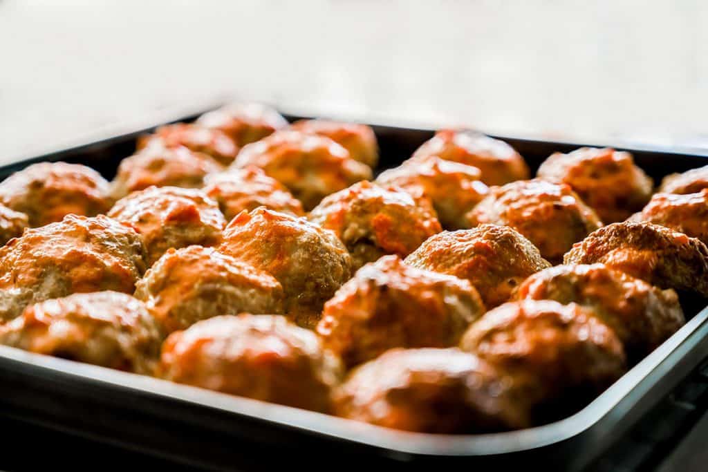 oven cooked meatballs on a baking tray