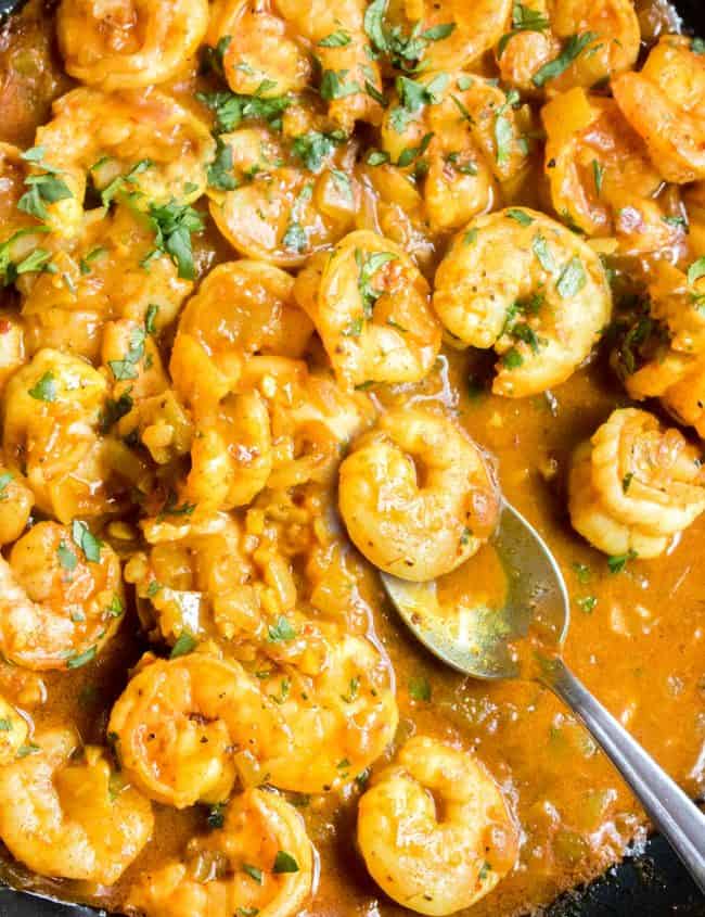 Shrimp Curry in the pan with a serving spoon ready to serve