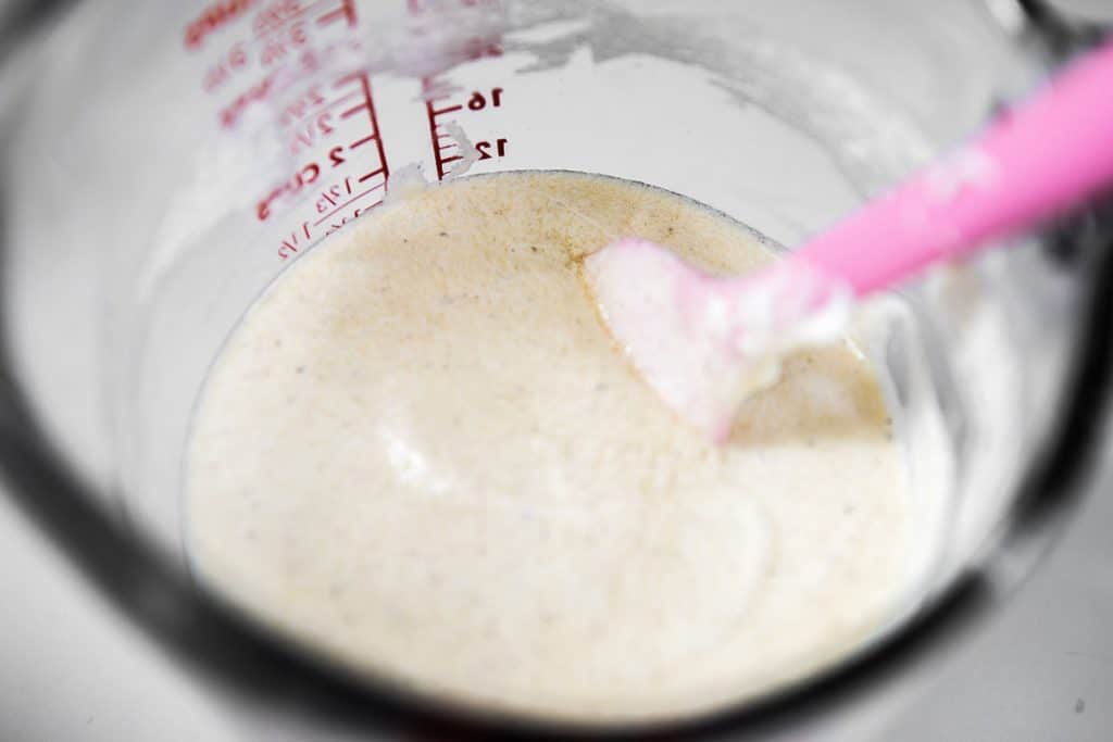 the sour cream mixture being mixed in a glass measuring cup