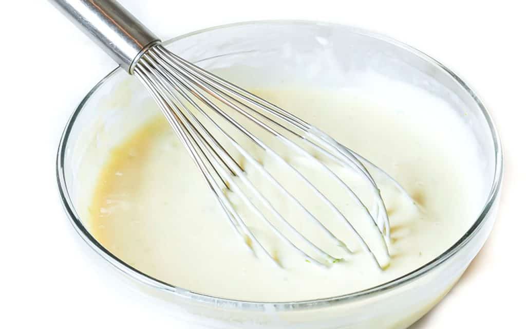 the filling mixture in a bowl with a whisk
