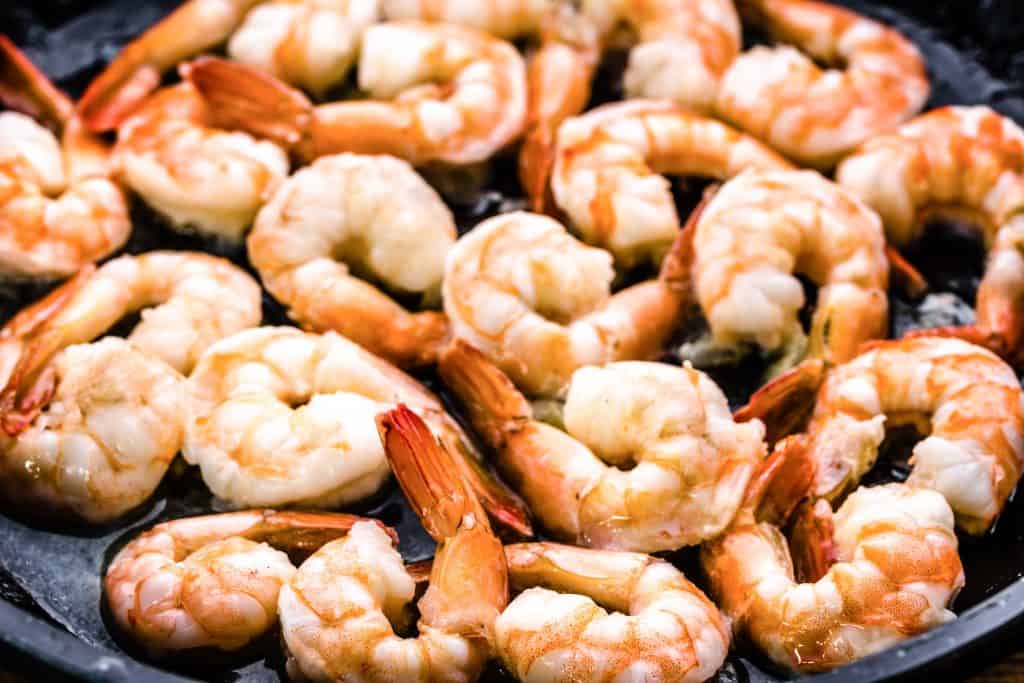 cooked shrimp in a pan with butter