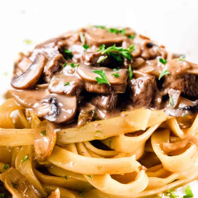 Beef and mushrooms in a creamy Stroganoff sauce over noodles