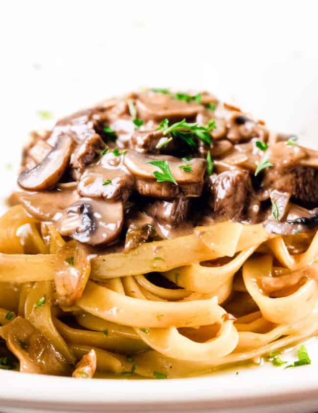 Beef and mushrooms in a creamy Stroganoff sauce over noodles