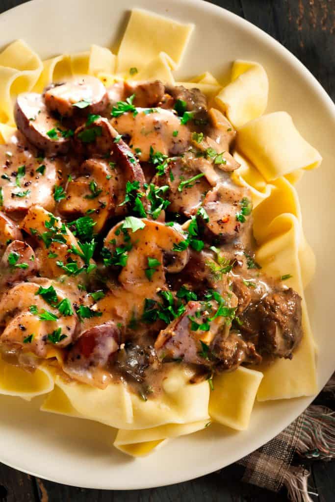 Beef and mushrooms in a creamy sauce over noodles