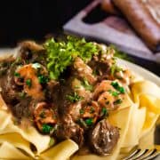 Beef and mushrooms in a creamy sauce over noodles