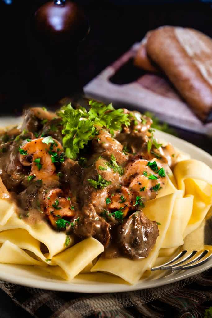 Beef and mushrooms in a creamy sauce over noodles
