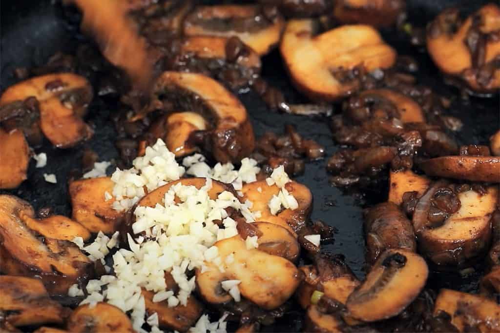garlic added to the pan with the mushroom mixture