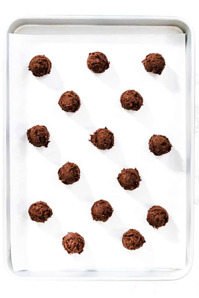 the Double Chocolate Chip Cookie dough balls on a baking sheet