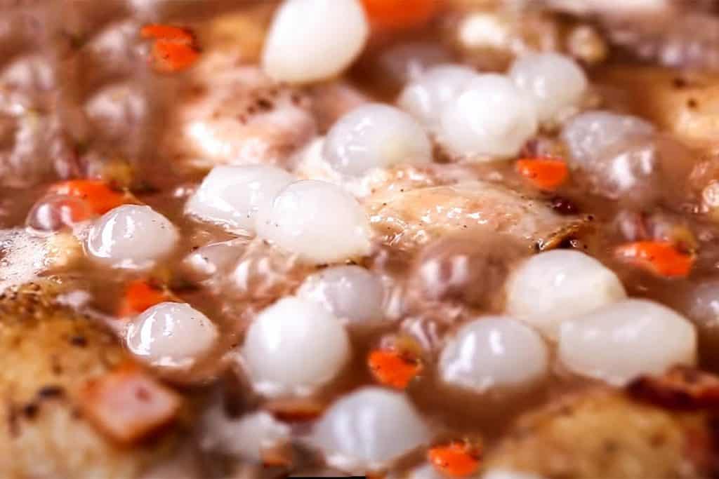 the onions and mushroons added to the sauce in the pan