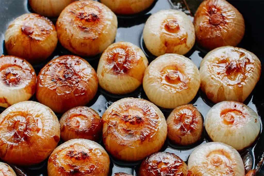 A pan of caramelized baby onions