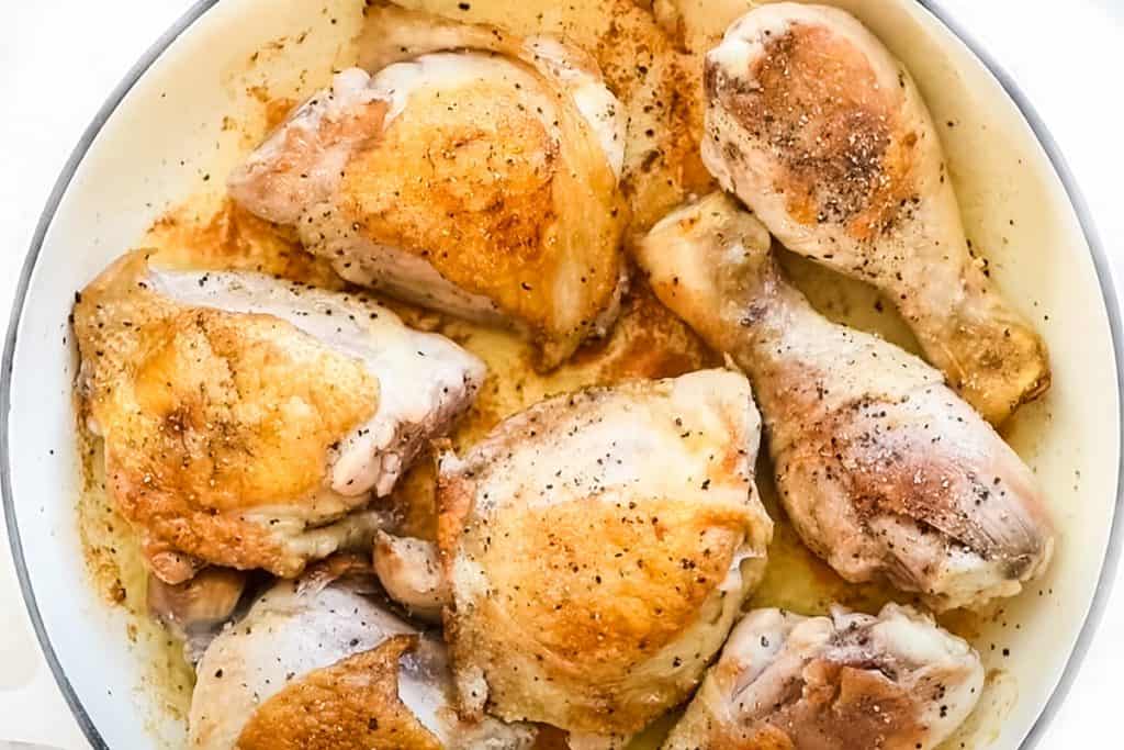 chicken frying in a pan