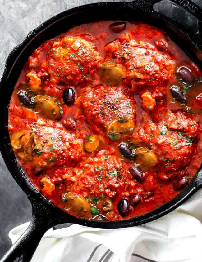 an overhead shot of chicken cacciatore in a pan