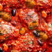an overhead shot of chicken cacciatore in a pan