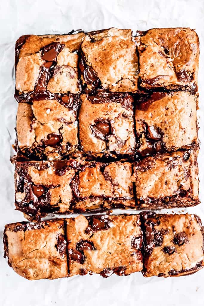 a sliced batch of gooey chocolate chip blondies