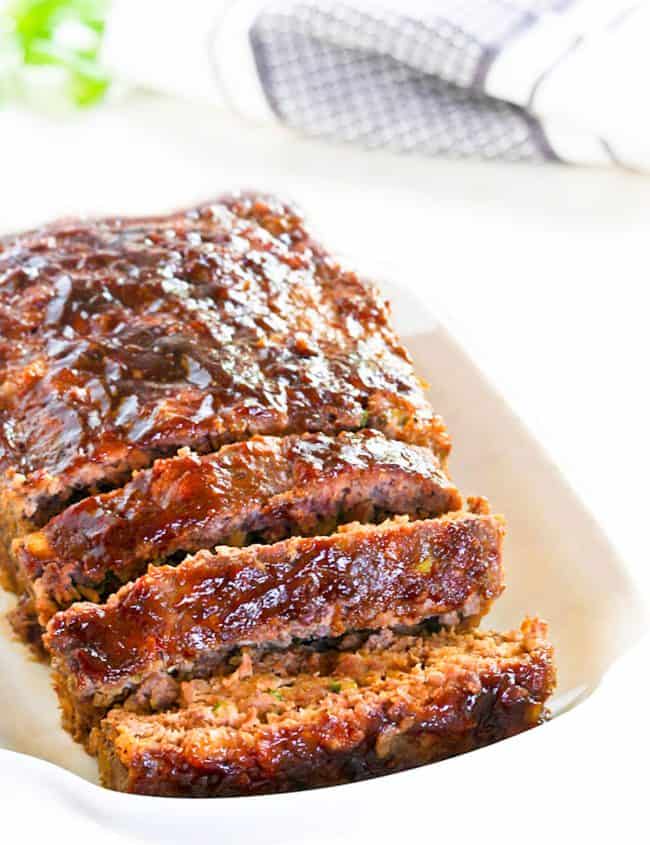 a sliced meatloaf on a serving dish