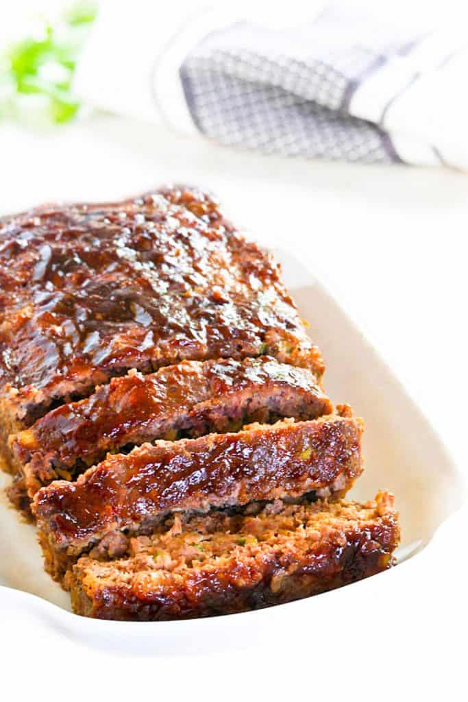 a sliced meatloaf on a serving dish