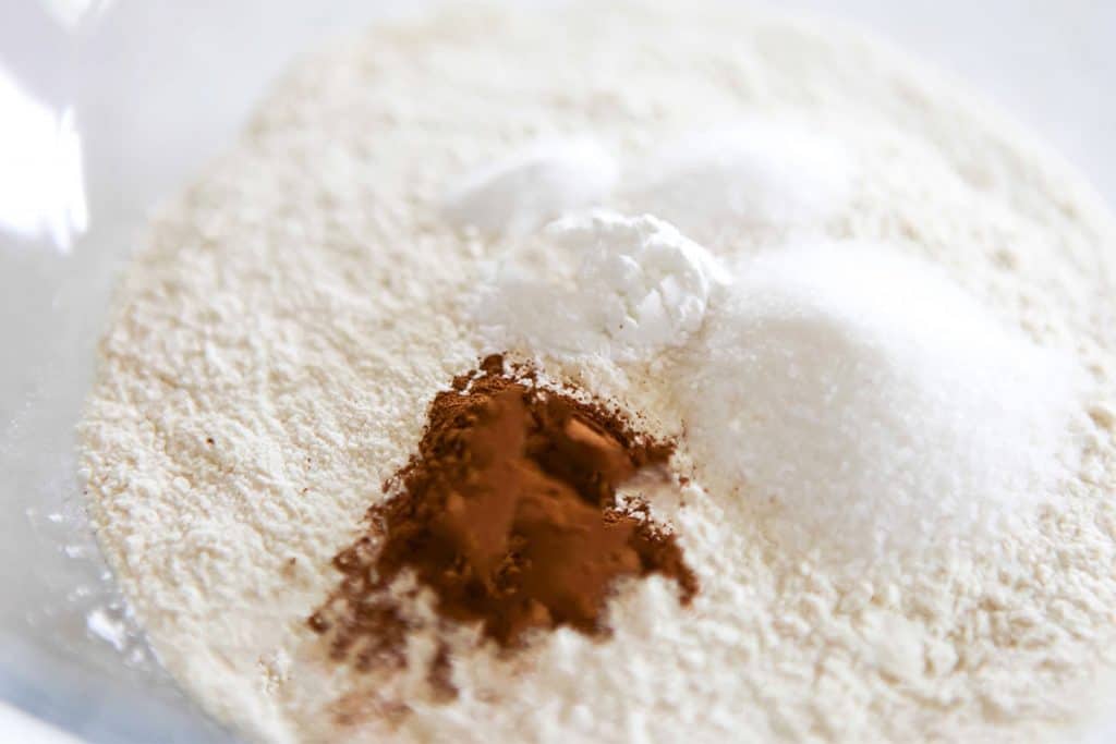 dry ingredients added to a glass bowl