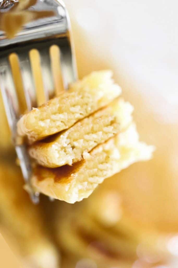 a fork with pancake pieces on it