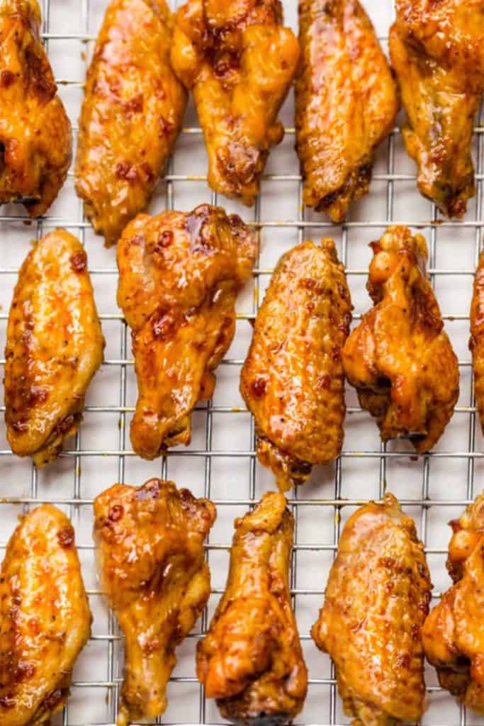 chicken wings on a wire rack placed in a baking tray