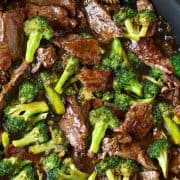 Beef and Broccoli in a pan with a brown sauce