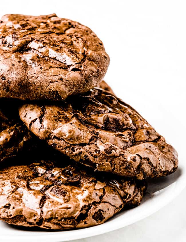 a stack of brownie cookies on a plate