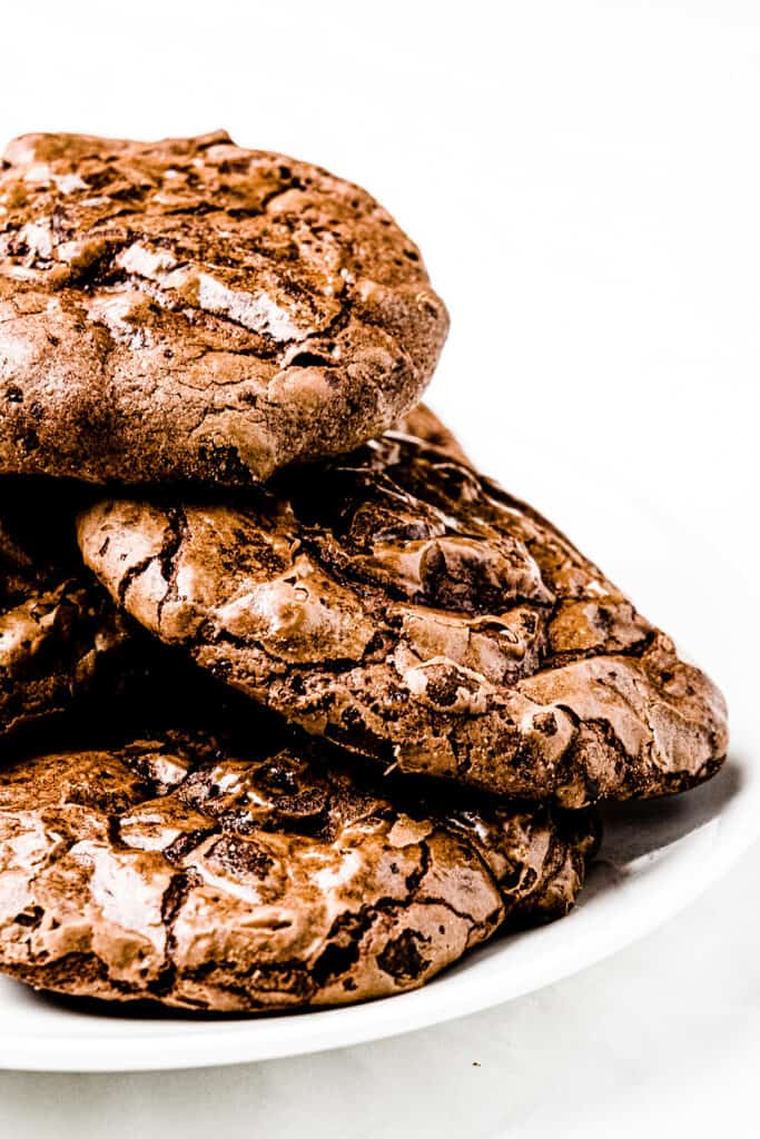 a stack of brownie cookies on a plate