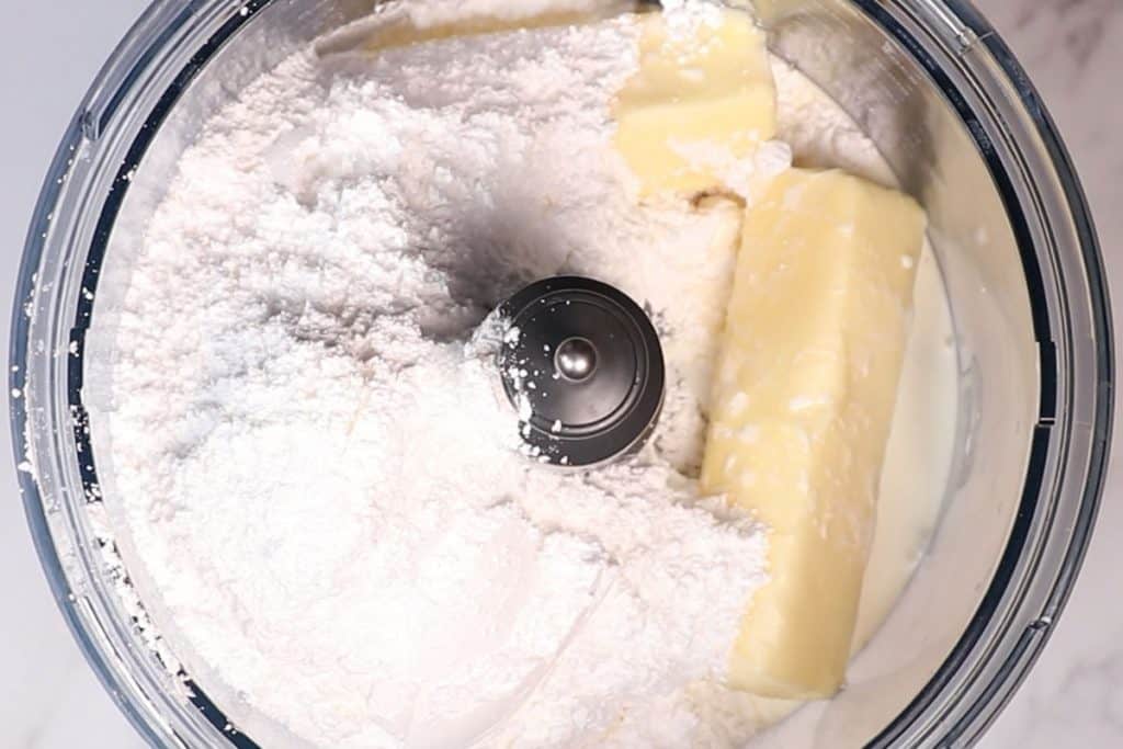 buttercream ingredients in a food processor