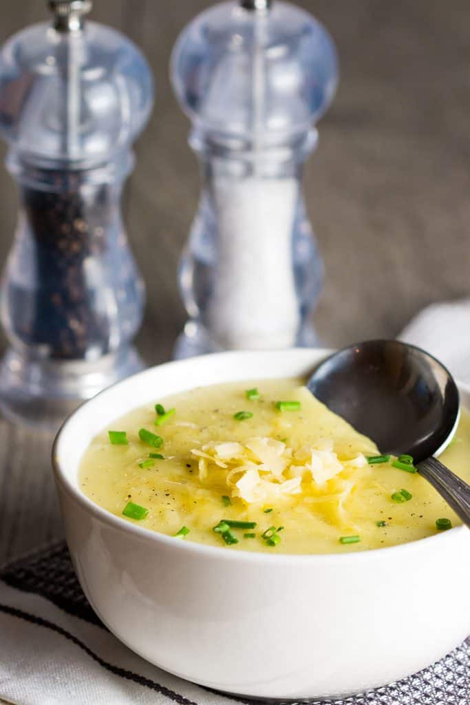 potato leek soup topped with chopped chives and grated cheddar