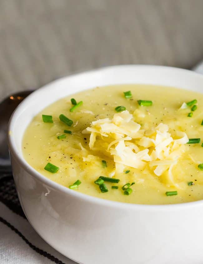 potato leek soup topped with chopped chives and grated cheddar