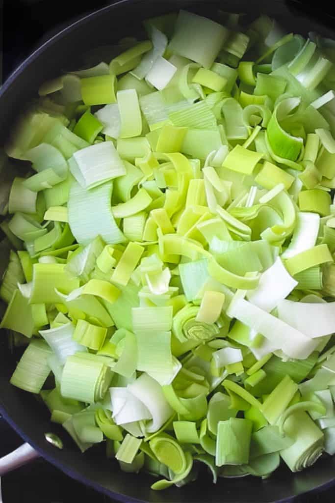 leeks cooking in a pan