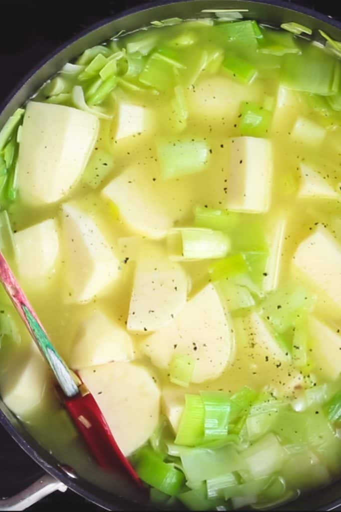 potatoes, leeks and stock in a pan