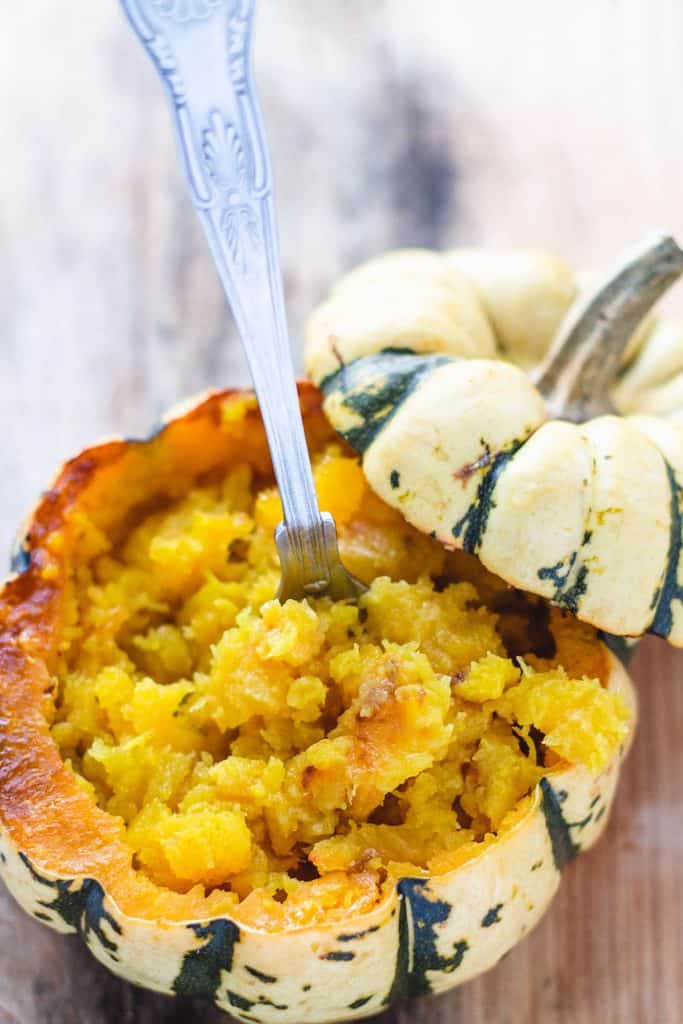 a roasted squash shell with mashed squash filling