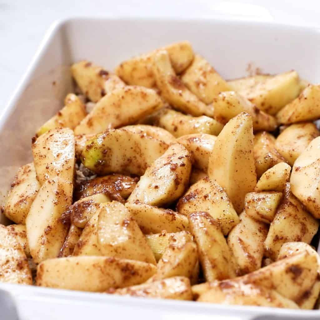 apple mixture added to a baking dish