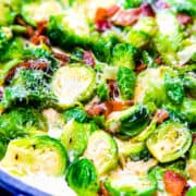 a pan with brussels sprouts and bacon in a cream sauce