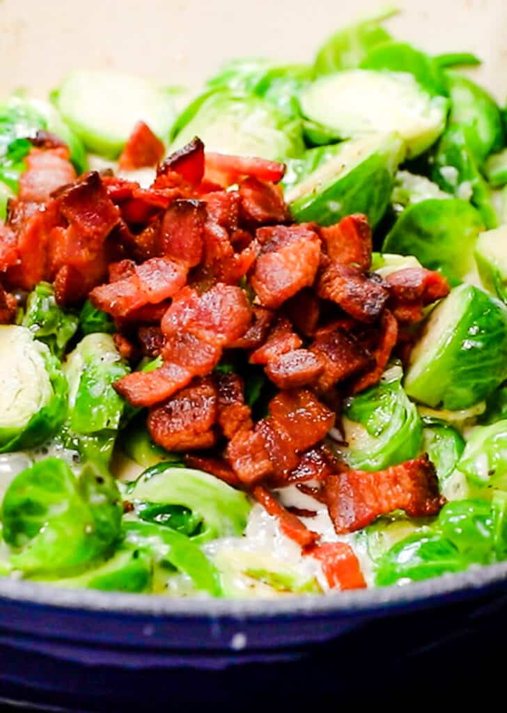 Chopped bacon added to the pan with the brussels sprouts mixture