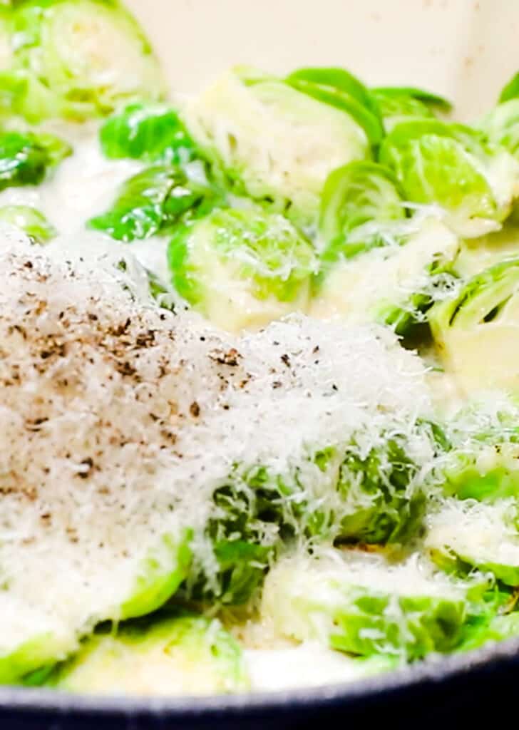 Grated cheese with pepper added to the pan