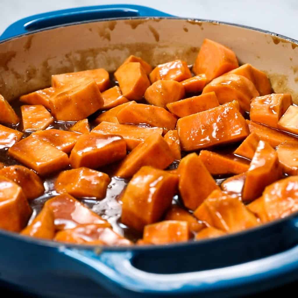 the sweet potatoes added to the pan with the sauce