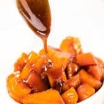 caramel sauce being spooned onto sweet potatoes