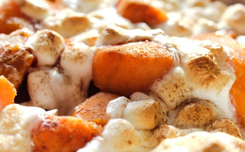 Close up of sweet potatoes with cinnamon and marshmallows
