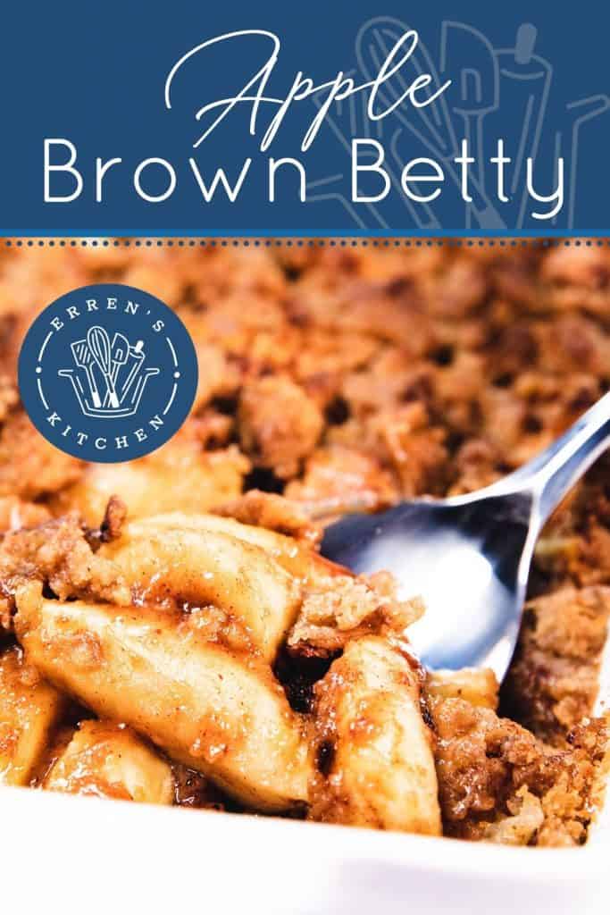 A spoon scooping out a serving of apples with crumb topping