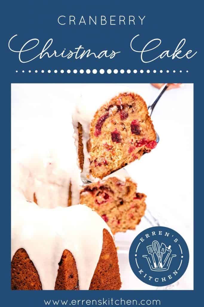 a slice of cake being cut out of the cranberry christmas cake