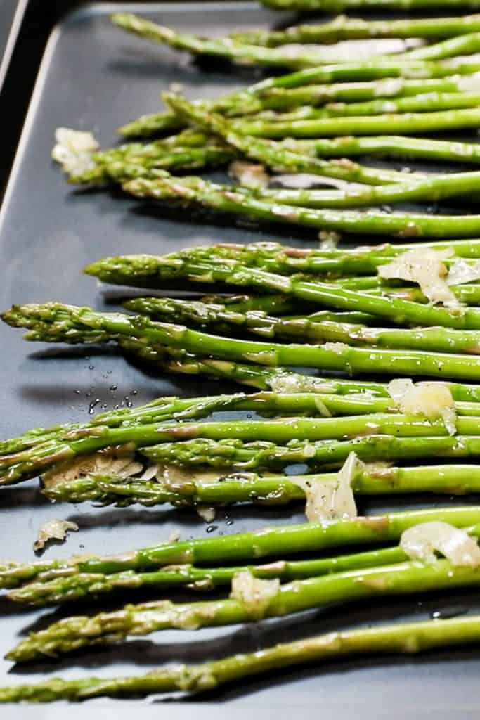 Asparagus lined up on a pan