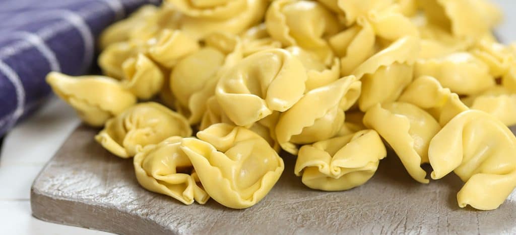 raw Tortellini on a cutting board