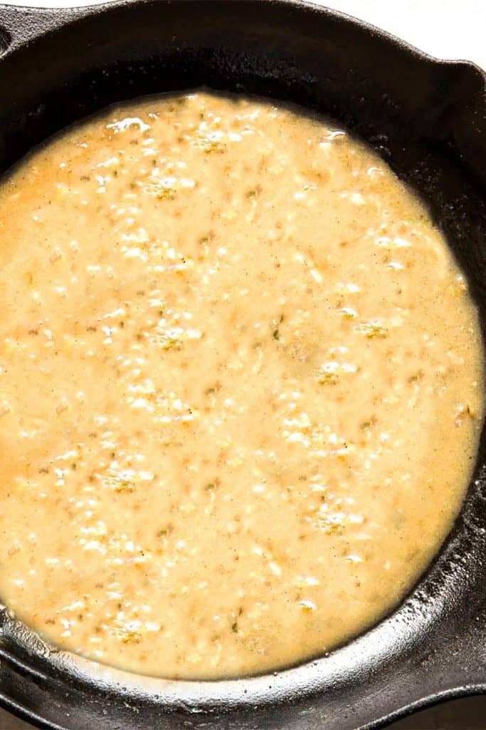 The thickened sauce in a pan